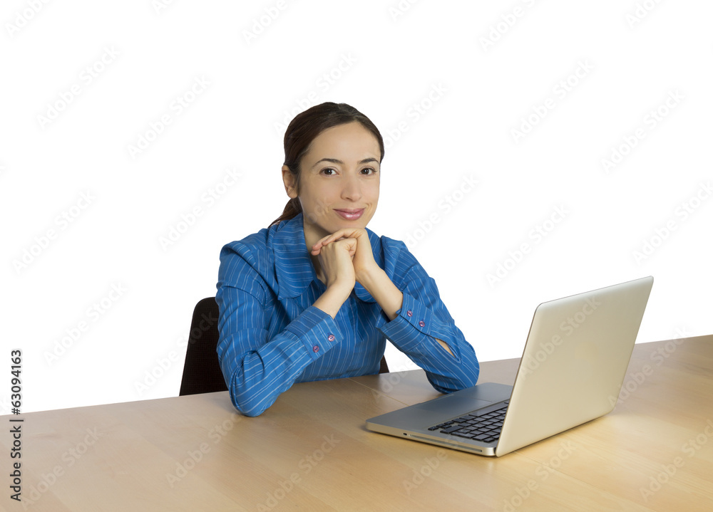 Young business woman in front of her computer and smiling Young business woman in front of her computer and smiling