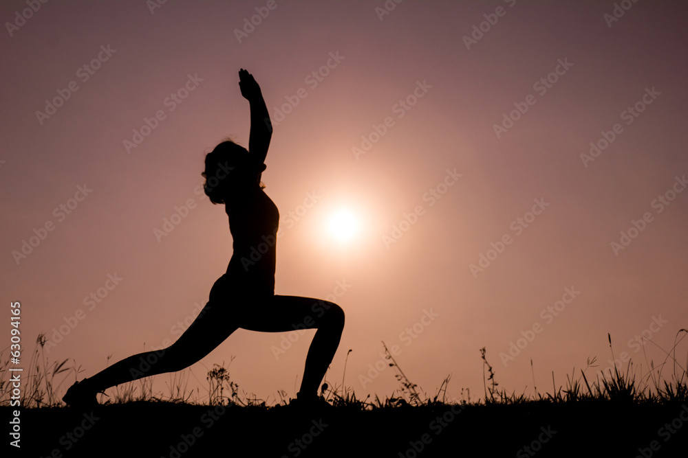 Silhouette woman with standing position yoga.