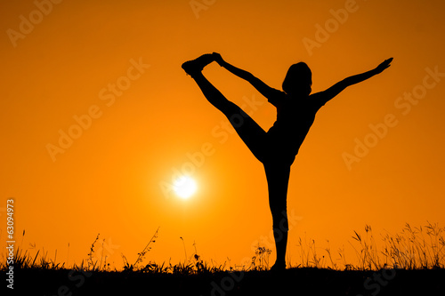 Silhouette woman with standing position yoga.