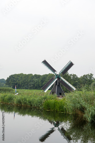 Dutch windmill near the river