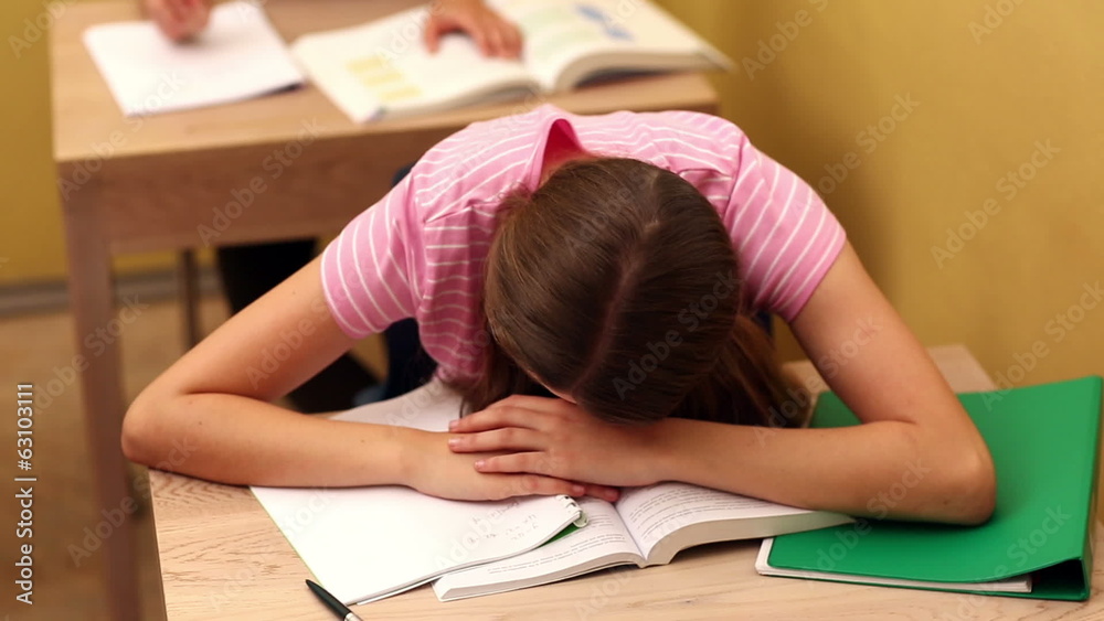 Student sleeping on desk during class Student sleeping on desk during class