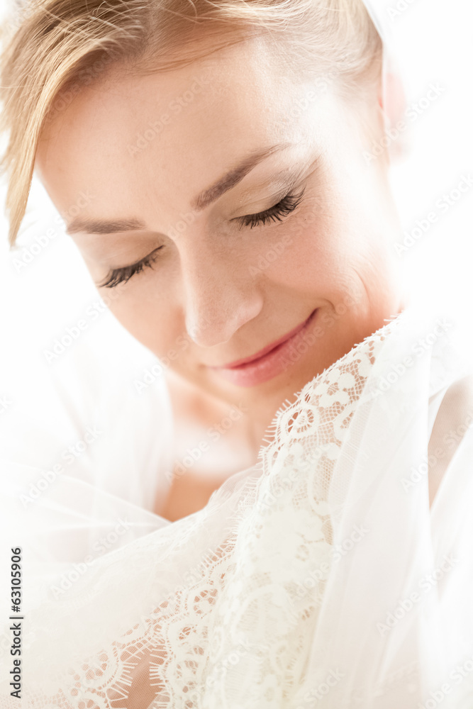 Closeup portrait of cute smiling bride with closed eyes Closeup portrait of cute smiling bride with closed eyes