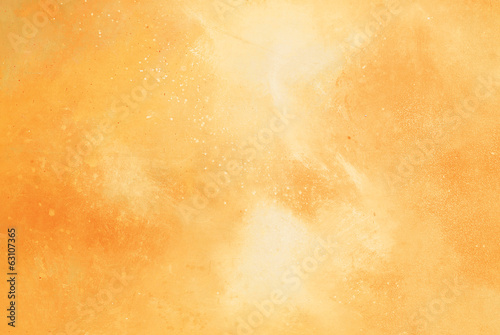 Abstract yellow/orange watercolor background.