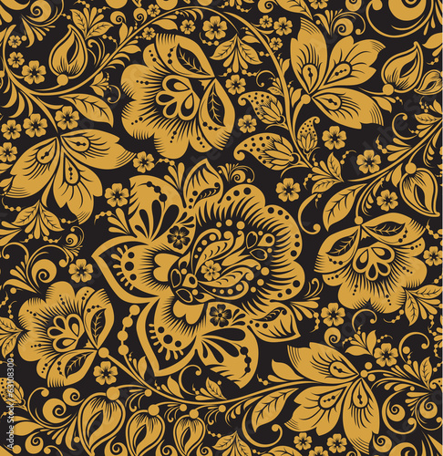 Seamless floral pattern. Beige flowers on a gold background.