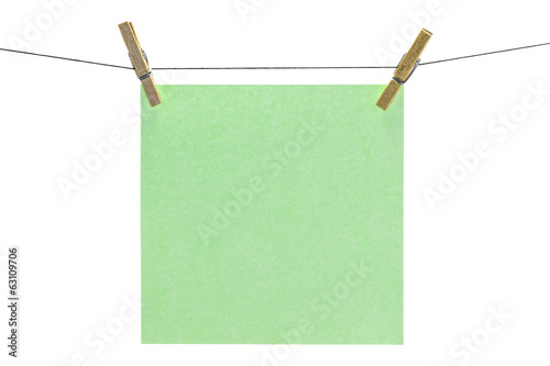 Flat green square sticky note hanged.