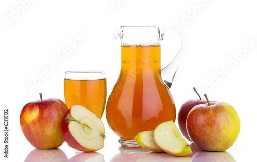 Fresh apples, glass with juice and carafe