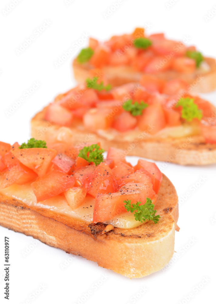 Delicious bruschetta with tomatoes isolated on white Delicious bruschetta with tomatoes isolated on white