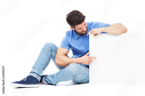 Sitting man with empty poster