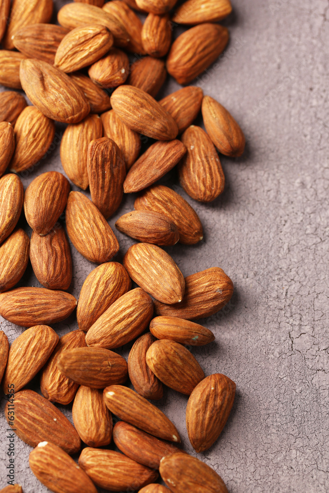 Almonds on color wooden background Almonds on color wooden background