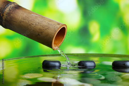 Spa still life with bamboo fountain  on bright background