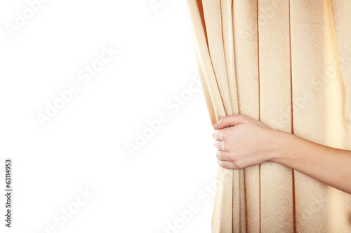 Hand opening curtain isolated on white photo
