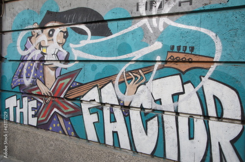 Graffiti message with a cartoon figure, Sofia, Bulgaria