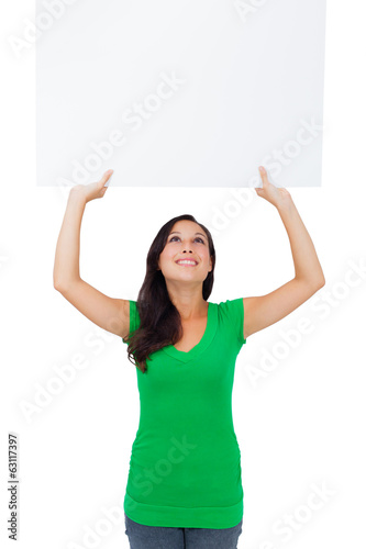 Beautiful caucasian woman holding a blank sign