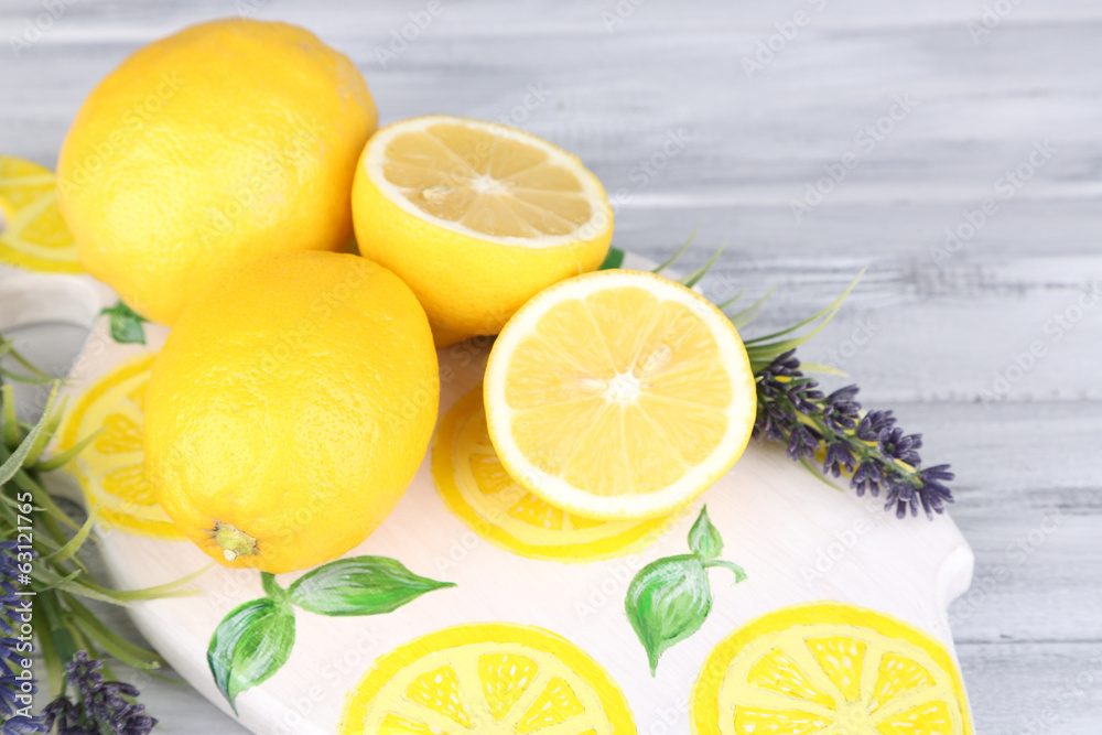 Still life with fresh lemons and lavender on wooden table Still life with fresh lemons and lavender on wooden table