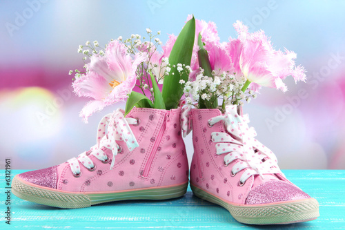 Beautiful gumshoes with flowers inside photo