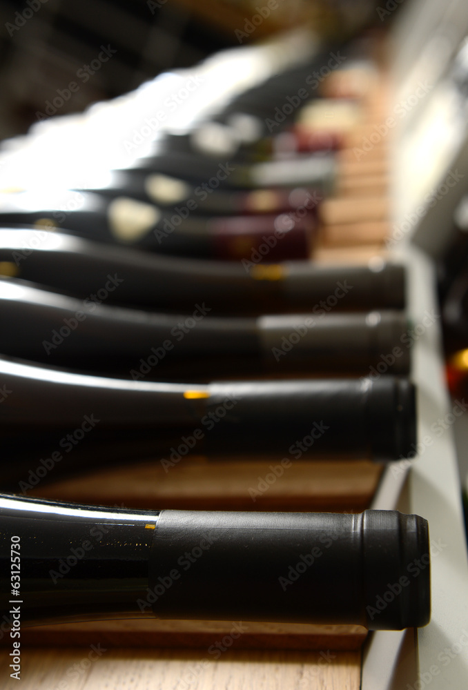 Naklejka premium Assortment of Wines on Wine Rack - Shallow Focus