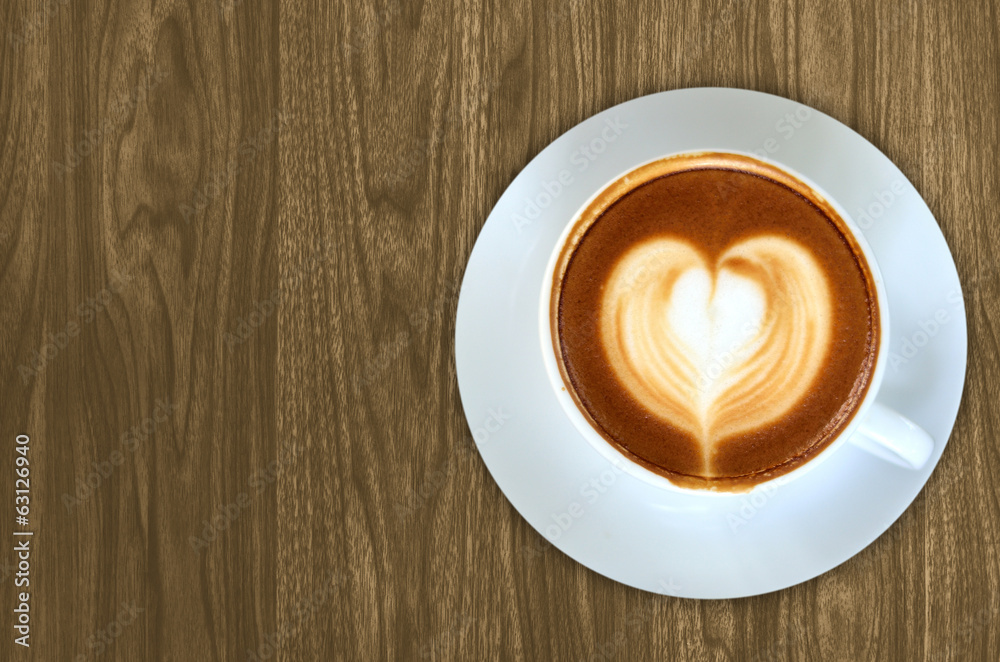 Coffee latte art on Wood background texture for design Coffee latte art on Wood background texture for design