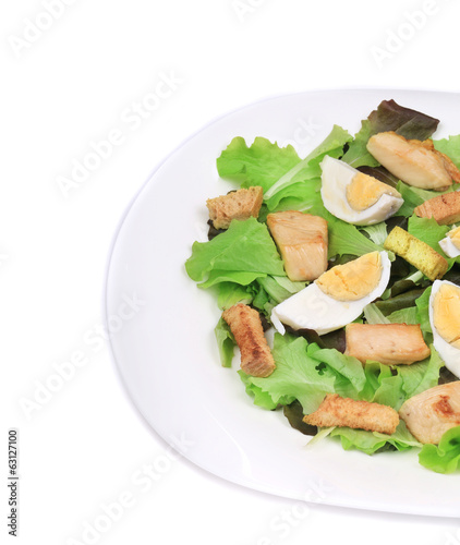 Close up of caesar salad with eggs.
