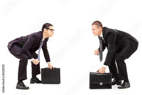 Two businessmen standing in sumo wrestling stance photo