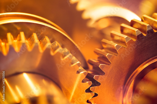Φωτογραφία golden gear wheels, close-up