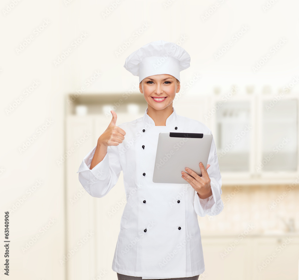 smiling female chef with tablet pc computer