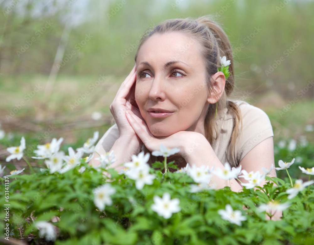 young beautiful woman on glade of blossoming snowdrops .. young beautiful woman on glade of blossoming snowdrops ..