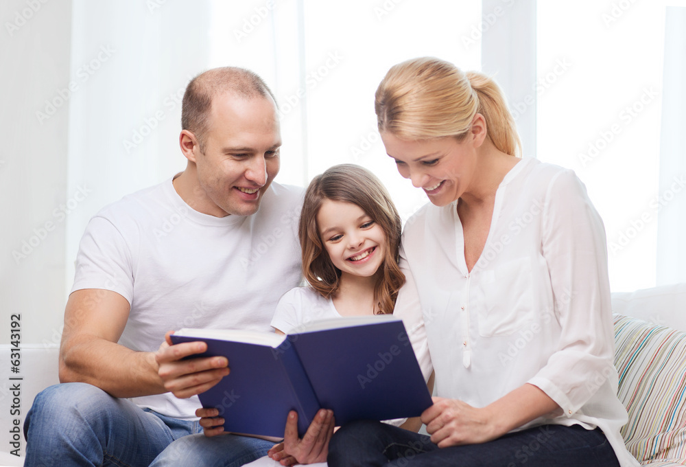 smiling parents and little girl with at home smiling parents and little girl with at home