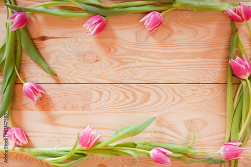 Fototapeta Naklejka Na Ścianę i Meble -  Tulips flowers frame and background wood. 