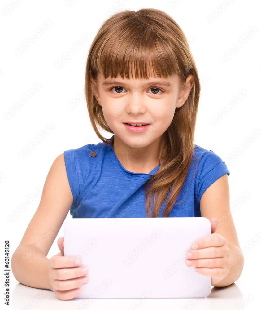 Young cheerful girl is using tablet Young cheerful girl is using tablet