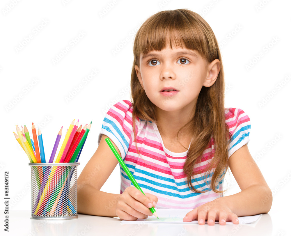 Little girl is drawing using pencils Little girl is drawing using pencils