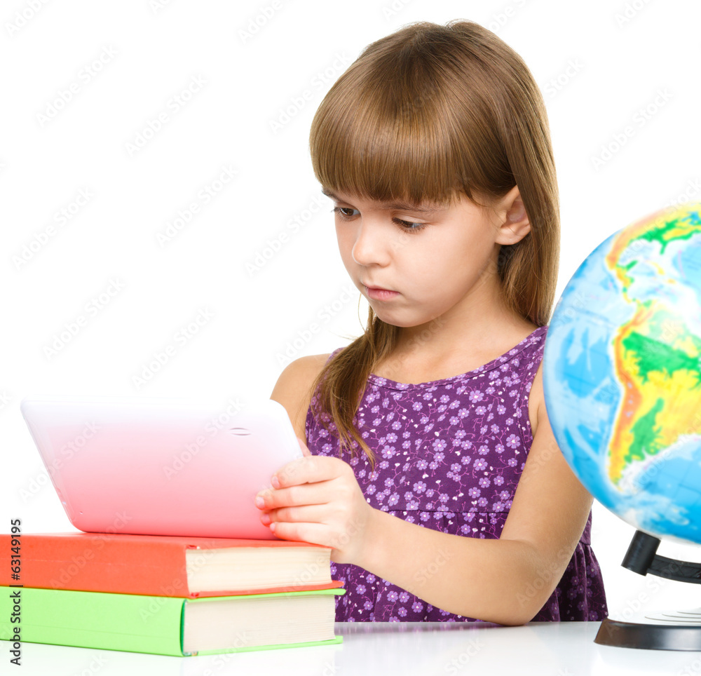 Young girl is using tablet