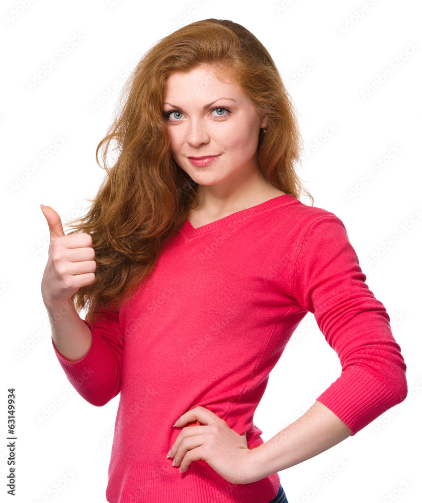 Woman is showing thumb up gesture Woman is showing thumb up gesture