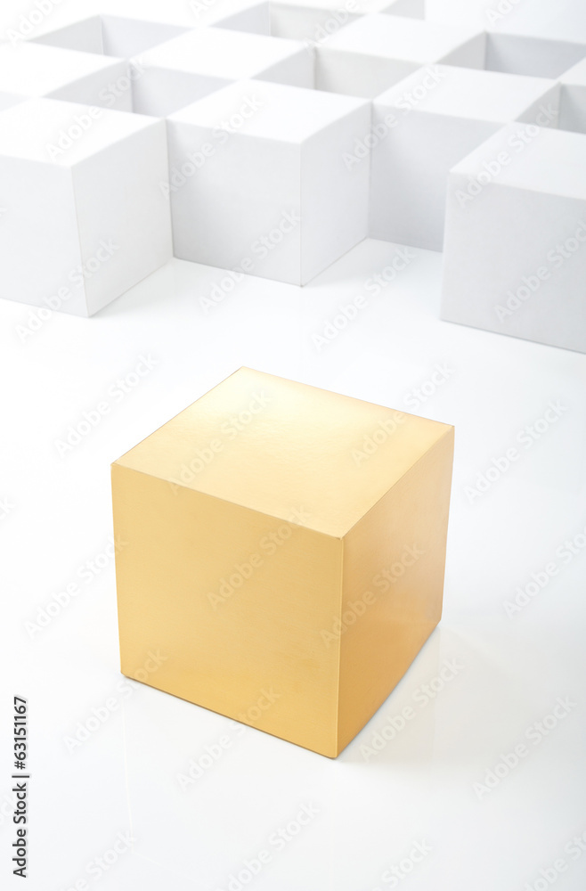 gold cube stands out among white cubes gold cube stands out among white cubes