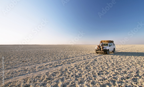 Car in the middle of salt lake near Kubu island