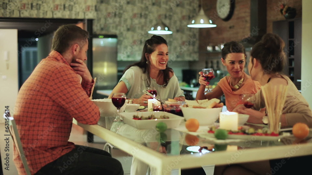 Friends partying talking and smiling, steadycam shot. Friends partying talking and smiling, steadycam shot.