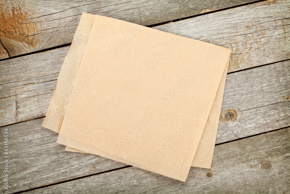 Cooking paper over wooden table Cooking paper over wooden table