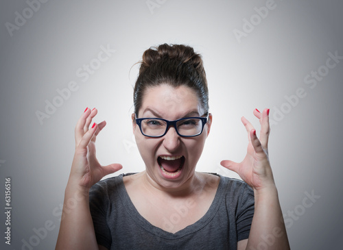 Woman screaming in horror  grimace portrait