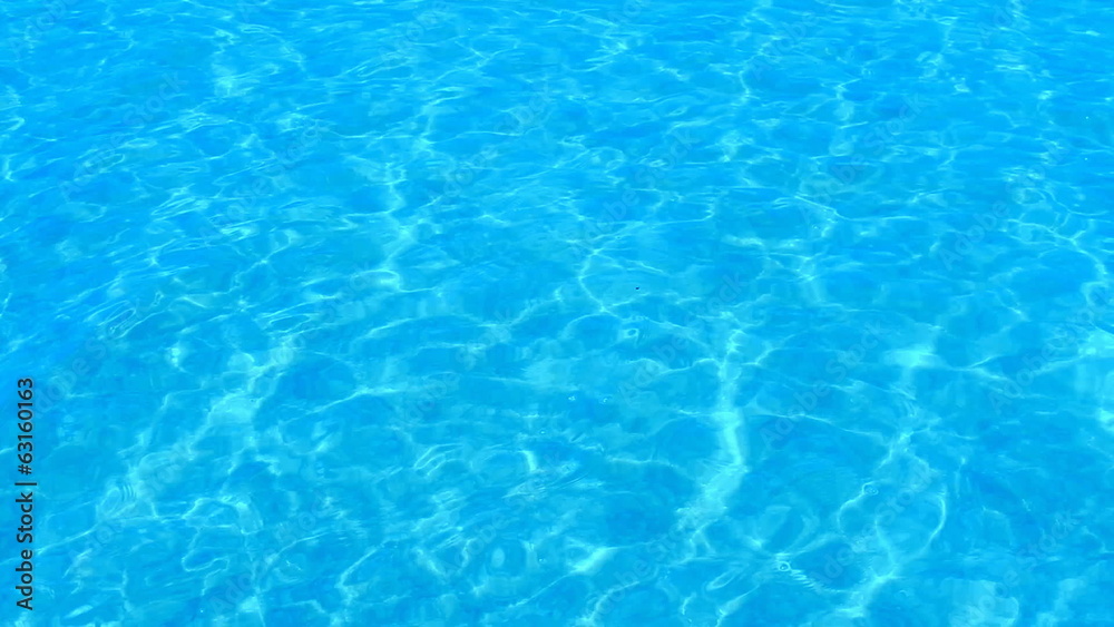 Beautiful refreshing blue swimming pool water Beautiful refreshing blue swimming pool water