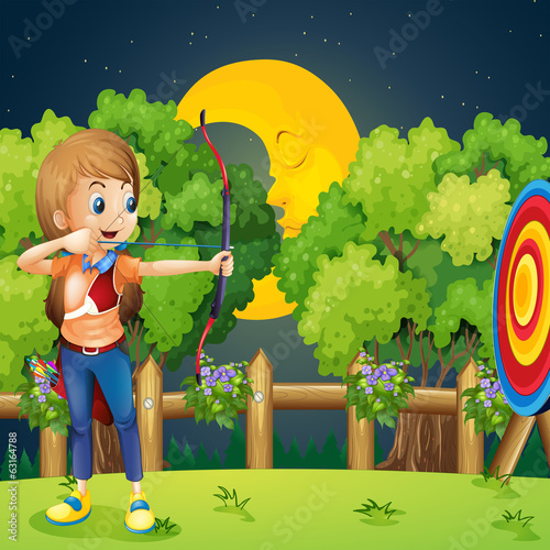 A girl playing archery
