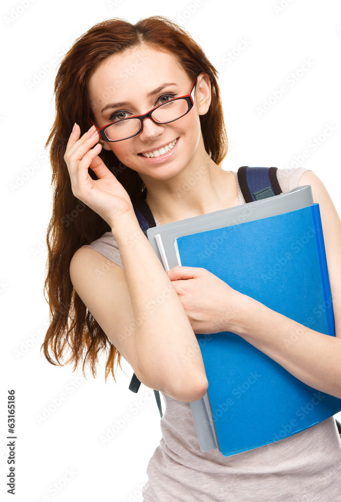 Young student girl is holding book Young student girl is holding book