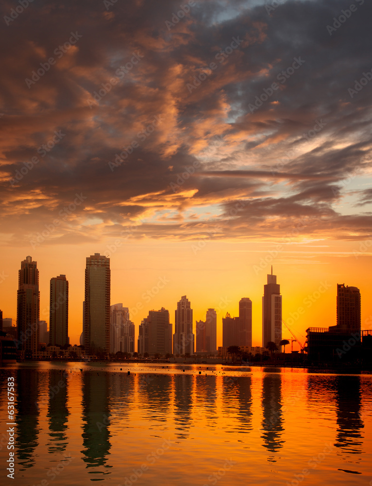 Dubai city with skyscrapers against sunset  United Arab Emirates
