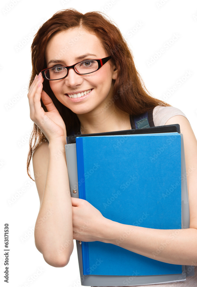 Young student girl is holding book Young student girl is holding book