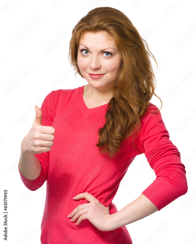 Woman is showing thumb up gesture Woman is showing thumb up gesture
