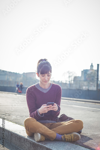 young beautiful hipster woman using smart phone