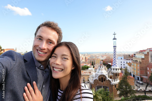 Happy travel couple in Park Guell, Barcelona