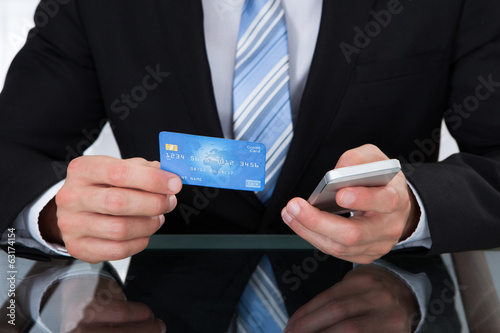 Businessman doing online banking photo