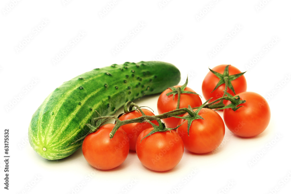 Red cherry tomatoes and green cucumber Red cherry tomatoes and green cucumber