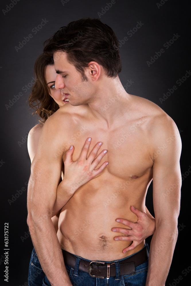 Naklejka premium Woman Embracing Passionate Man