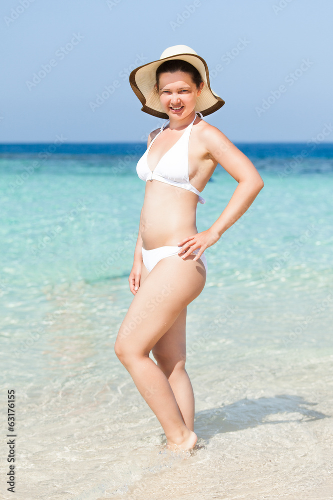 Woman Wearing Sunhat Posing In Sea Woman Wearing Sunhat Posing In Sea