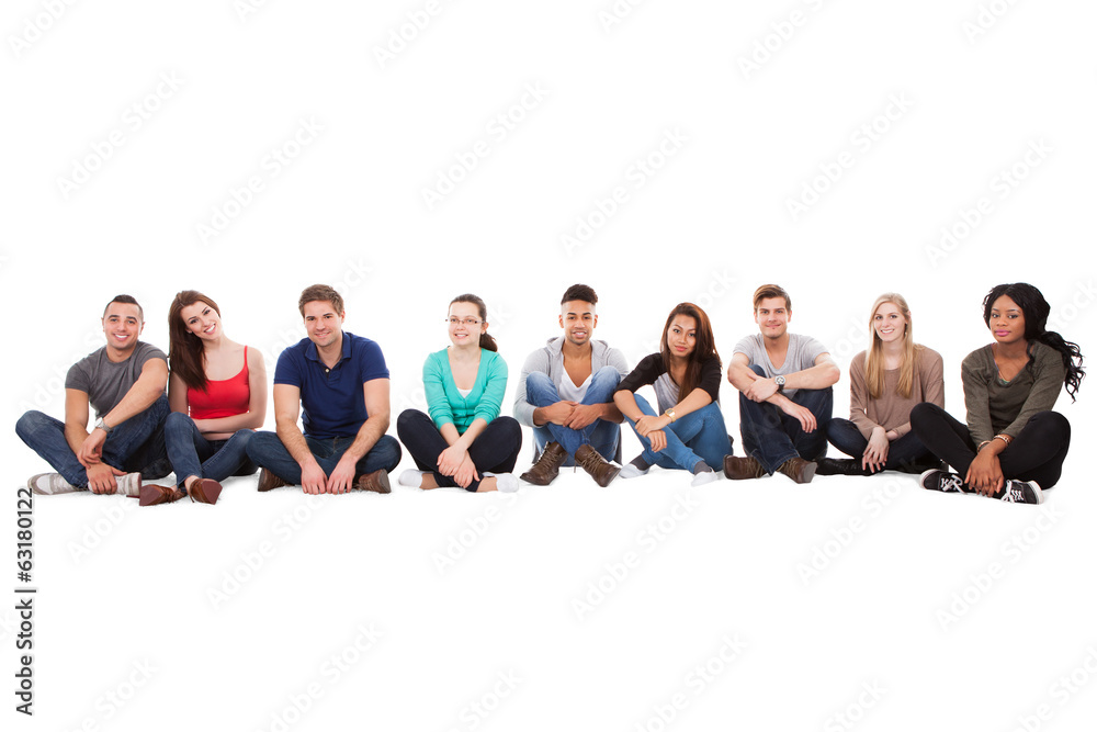 Multiethnic College Students Sitting In A Row Multiethnic College Students Sitting In A Row